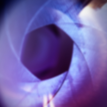 Abstract blurred image of aperture of old retro camera lens as a background for your designの写真素材