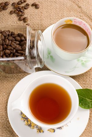 coffee, coffee beans and tea with green leafの写真素材