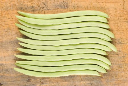 Kidney bean in a row on old wooden background, one kind of delicious vegetable in Chinaの写真素材
