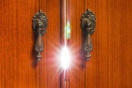 Mystery light from the wooden cabinet. Mystery concept.の写真素材