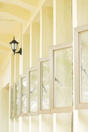 Row of opened windows in white buildingの写真素材