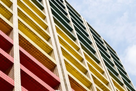 Colorful building under blue sky, office building.の写真素材