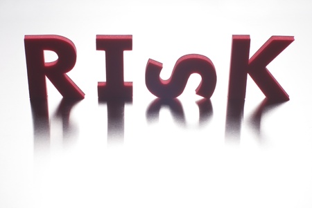 Risk word on metal background, part of a series of business wordsの写真素材