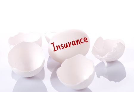 Save your investment. Egg and broken eggshells on white background 