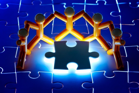 Team work on solving puzzle problem. Team work concept.の写真素材