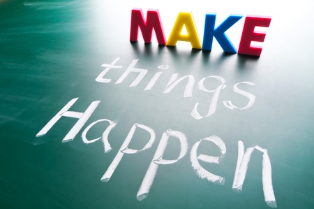 Make things happen, concept words draw on blackboard.の写真素材
