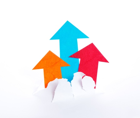 Colorful arrowheads move upward and break paperの写真素材