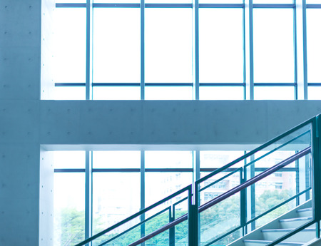 Office building with glass windows and sunshineの写真素材