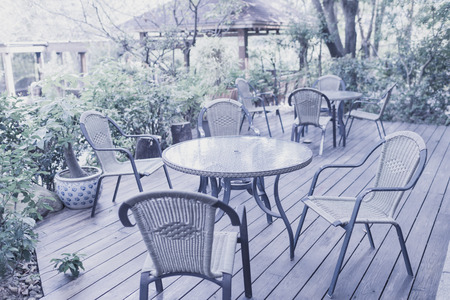 Tables and chairs of cafeteria outside in garden