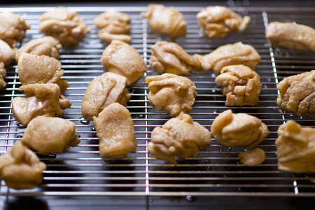 Delicious fried chicken nuggets on iron plateの写真素材