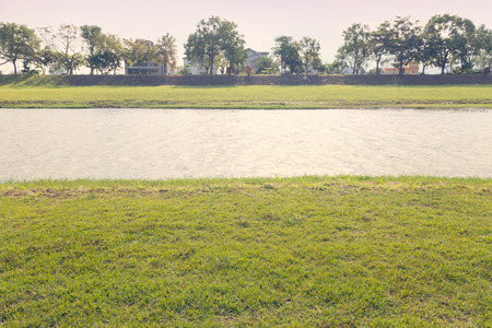 River flowes green meadow land under sunny day, Dong Shan River, Yilan City, Taiwanの写真素材