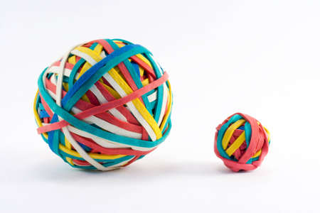 Big and small rubber band balls on whiteの写真素材