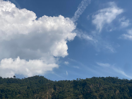 Clouds in the blue sky over the mountain. Landscape.の写真素材