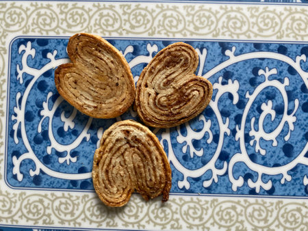 Cookies in the shape of a heart on a blue and white backgroundの写真素材