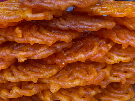 close up of a bowl of deep fried sweet potato snack on a table