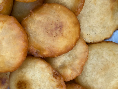 close up of a pile of fried potato pancake as a background
