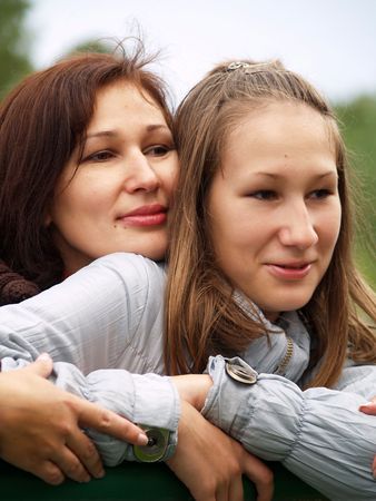 Mother and the daughter with enthusiasm observe of occurring event.の写真素材