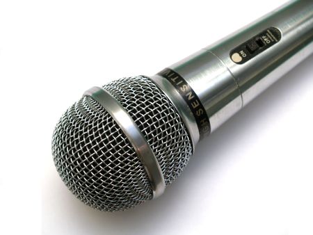 Silver vocla microphone with off/on swither on white backgroundの写真素材