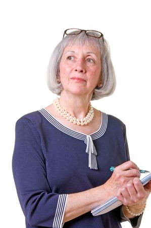 Confident senior woman taking notes