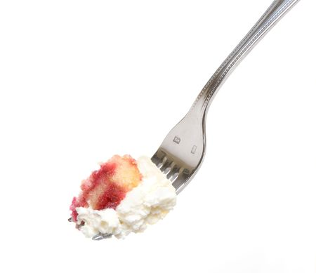 A single bite of berry cheesecake with lots of whipped creamの写真素材