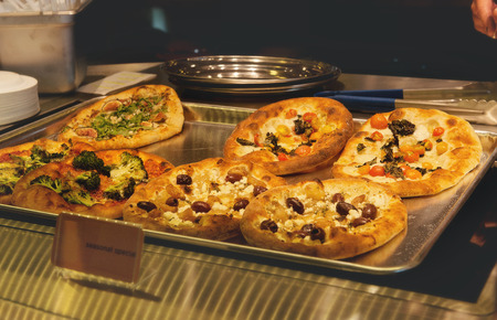 Restaurant tray of mini pizzas. の写真素材