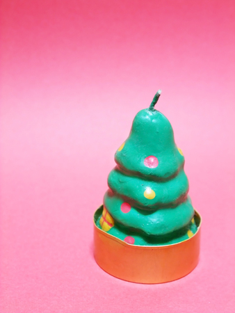 Candle in the form of a Christmas treeの写真素材