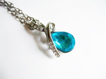 Necklace with a blue jewelの写真素材