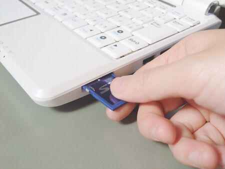 Insert the SD card into the laptop