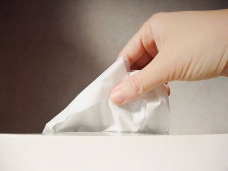 Pulling out tissue paper by handの写真素材