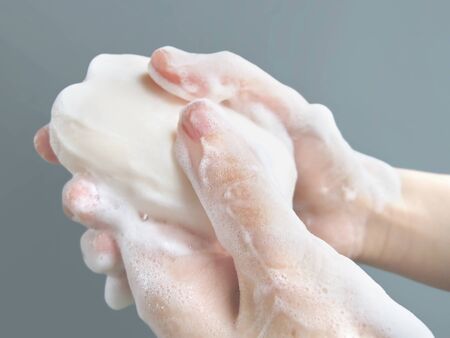 Scrub with soap and wash handsの写真素材