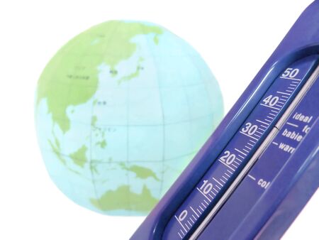 A paper globe and a thermometer