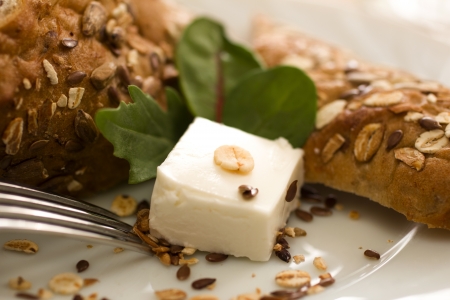 bun with sesame seeds and cheese for breakfast