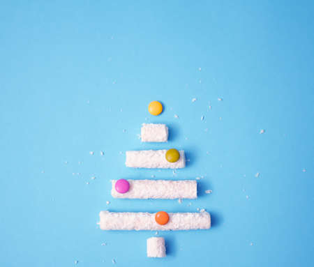 Christmas candy tree on a blue pastel bacground.