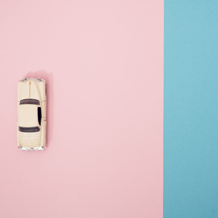 White limousine on a pink and blue pastel background. Minimal pattern.の写真素材