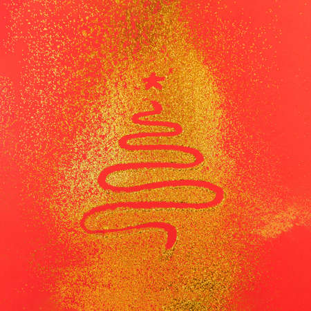 New year tree drawn on a yellow gold glitter red pastel background. Christmas scene, Minimal concept.の写真素材