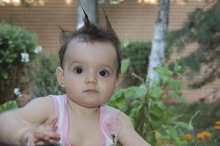 New hairstyle produces surprise for a kidの写真素材