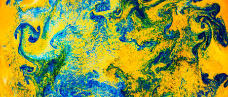 Fluid Art. Abstract blurred colorful background. Swirl liquid pattern. Marble effect of green color. Trendy colorful backdropの写真素材
