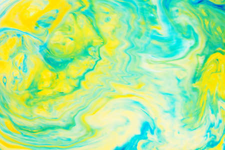 Fluid Art. Abstract blurred colorful background. Swirl liquid pattern. Marble effect of green color. Trendy colorful backdropの写真素材