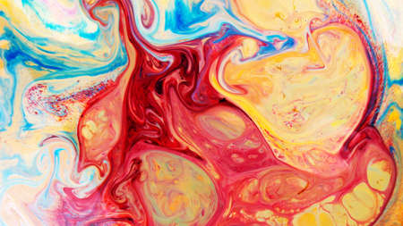 Fluid Art. Abstract blurred multi-colored background. Swirl liquid pattern. Trendy colorful backdrop. Mixing paintsの写真素材