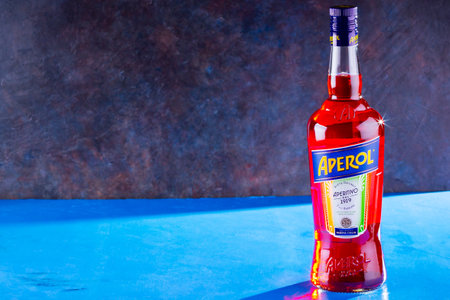 Padua (Padova), Italy - May 16, 2020: Bottle of Aperol Aperitivo summer cocktail drink on black blue background. Famous Italian aperitif. Copy spaceのeditorial素材