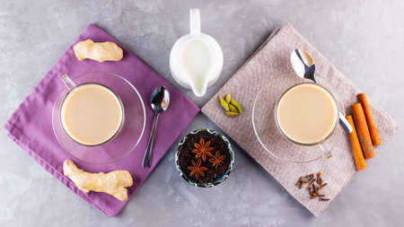 Masala chai tea. Traditional indian drink - masala tea with spices on gray background. Top viewの写真素材