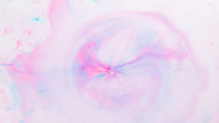 Fluid art texture. Pink blue background from liquid. Photography of colored spots on liquid....