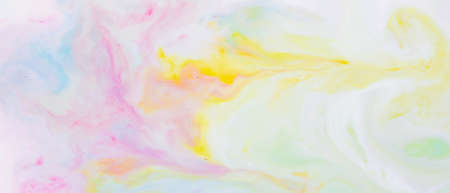 Fluid art. Multicolored background from liquid. Photography of colored spots on liquid. Abstract patternの写真素材