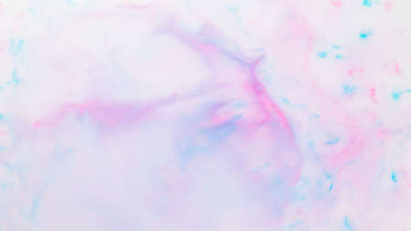 Fluid art texture. Pink blue background from liquid. Photography of colored spots on liquid. Abstract patternの写真素材