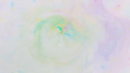 Fluid art. Multicolored background from liquid. Photography of colored spots on liquid. Abstract patternの写真素材