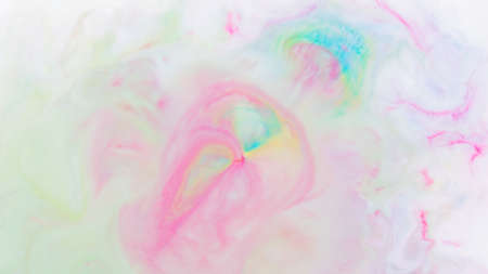 Fluid art. Multicolored background from liquid. Photography of colored spots on liquid. Abstract patternの写真素材