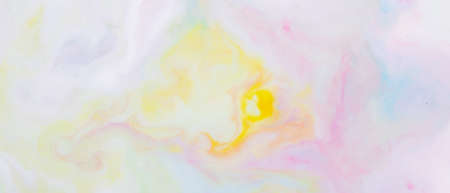 Fluid art. Multicolored background from liquid. Photography of colored spots on liquid. Abstract patternの写真素材