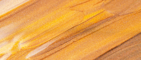 Abstract sparkling metallic texture. Bronze orange background with glittering smears. Creative...