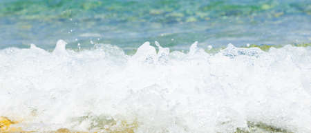 Sea wave and pebble. Summer vacation concept. Sea wave with foam incident on the coastal shingle. Travel conceptの写真素材