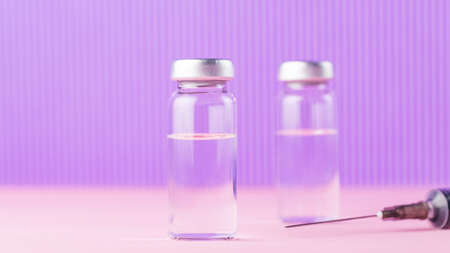 Vaccines and syringe on a pink purple background for prevention and immunization. Vaccine and syringe injection. Medical concept. Copy spaceの写真素材